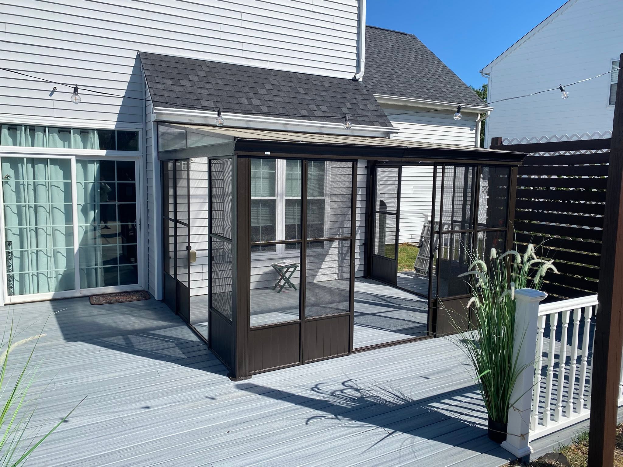 Finished screened outdoor room and deck by Spot On Drywall & Paint